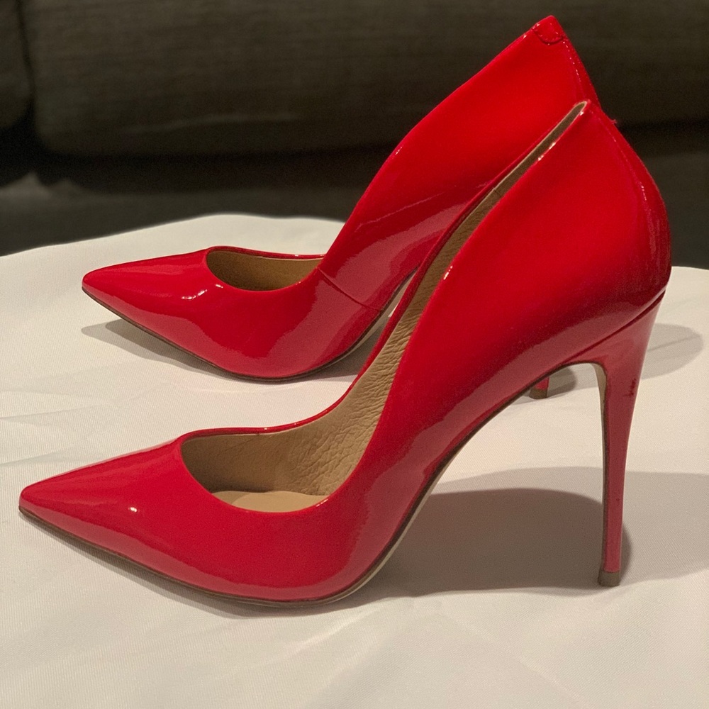 Red High Heel Patent leather pumps made by Steve Madden.